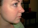 Double Nose Piercing, has two gold nosebones...