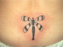 tribal dragonfly on lower back
