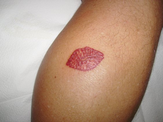 muh lips tattooed on a buff calf