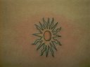 tiny sun on the lower back