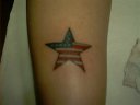 american flag inside a star on the back of the calf above ankle