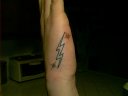 Lightning Bolt on outter side of hand with colored sparkles...OUCH right T-Bone?